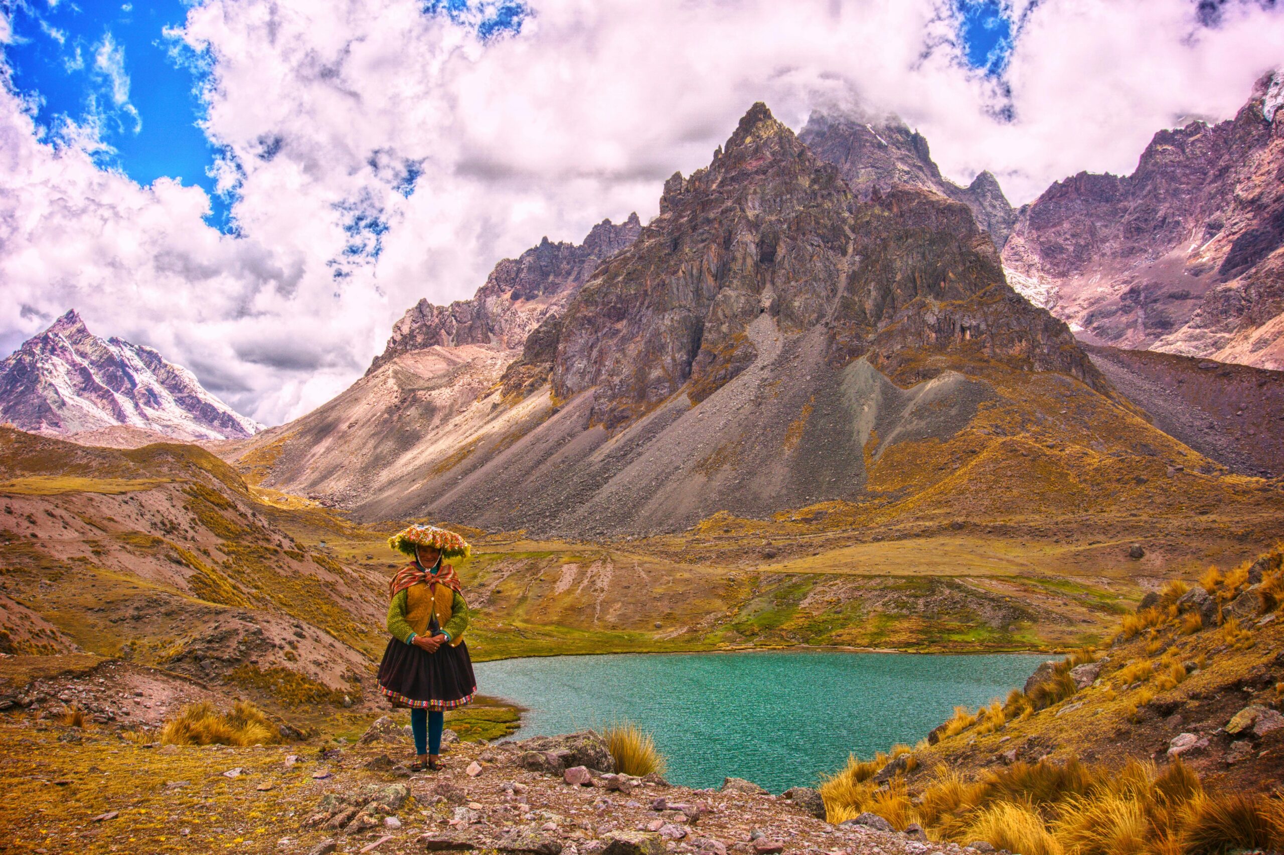 Photo by Yohuan Cuadros: https://www.pexels.com/photo/woman-in-traditional-folk-costume-at-the-lake-at-the-foot-of-nevado-auzangate-in-the-peruvian-andes-19211101/
