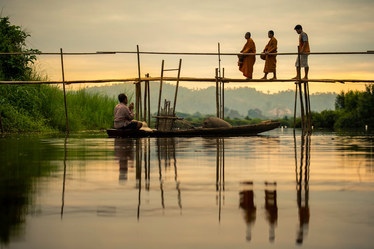 photo of people crossing a small bridge